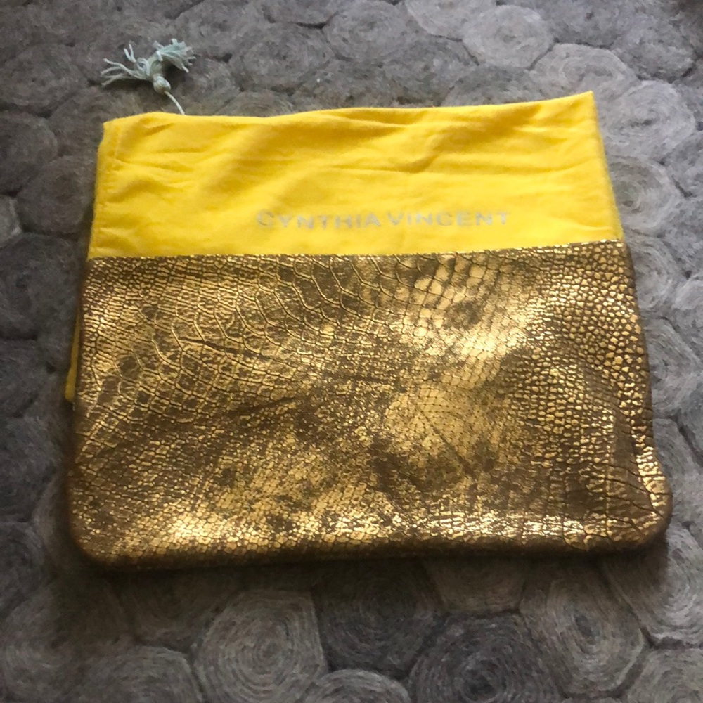 Cynthia Vincent leather embossed gold clutch NWOT comes w yellow dust cover.